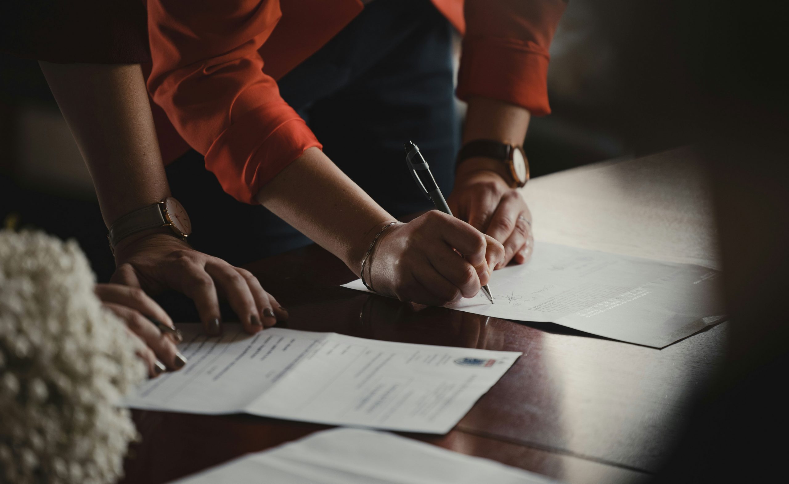 Right to work - woman signing paperwork